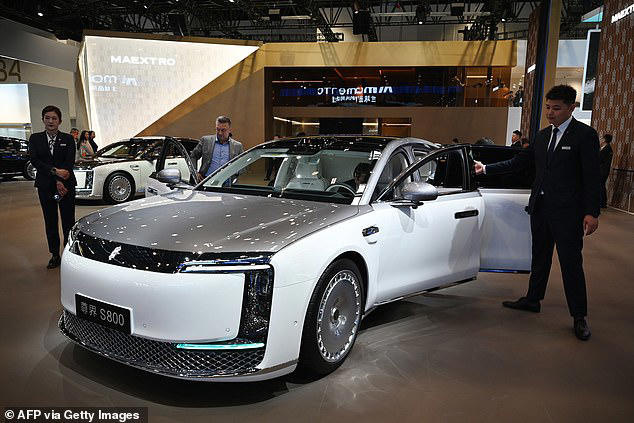 China's answer to the Rolls-Royce: £130,000 beast is packed with gadgets, a 40-inch TV and gold trim