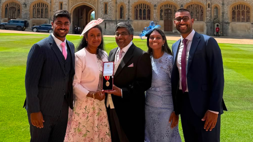 Professor Canagarajah with his wife and children in the grounds of Windsor Castle.