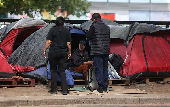 Chaos inside UK's migrant 'tent city' where homeless 'beg, gamble and urinate on streets'